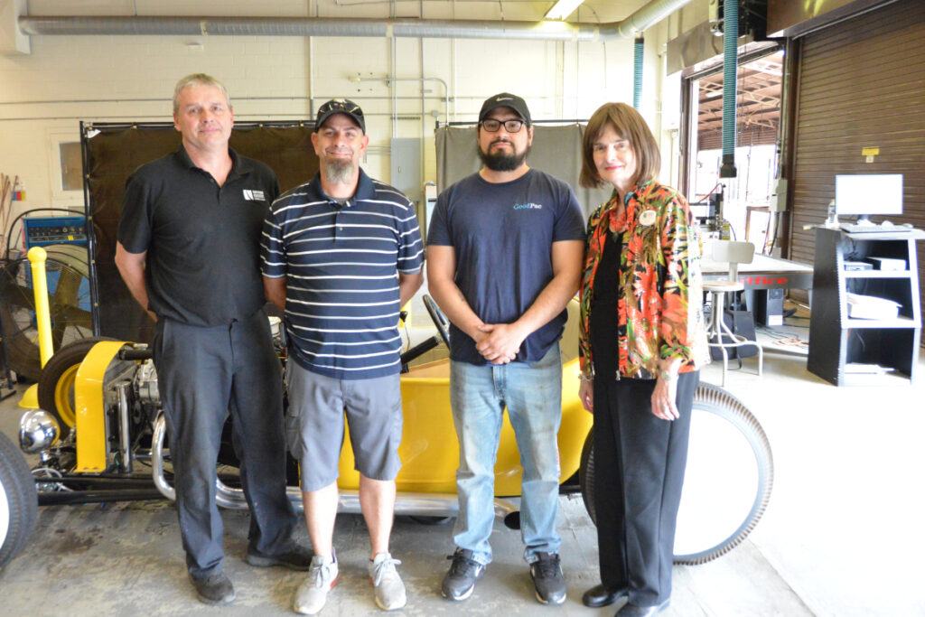 Pictured left to right are Arnold Cobb, Automotive Technology instructor; James Miracle, Automotive Technology student; Dustin Stephens, Automotive Technology student; and Barbara Jo Cook, Vice President for Advancement.