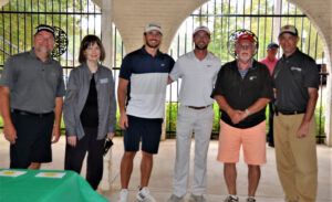 Pictured L-R: Todd Feltman, SCTC Foundation Trustee Emeritus and Barbara Jo Cook – SCTC Vice President for Advancement pictured with Piedmont Henry Golf Team: Zachary Butts, Justin Connelly, Steve Jordan, Jay Connelly