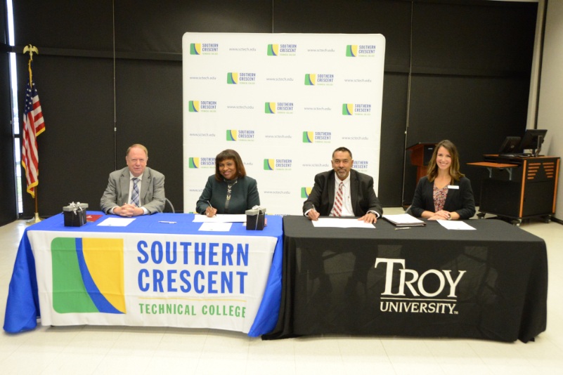 Pictured L-R: Dr. Steve Pearce, Vice President for Academic Affairs, Southern Crescent Technical College; Dr. Alvetta Thomas, President, Southern Crescent Technical College; Sohail Agboatwala, Vice Chancellor of Student Affairs and Administration, Troy University; Staci Hutto, Area Coordinator, Troy University