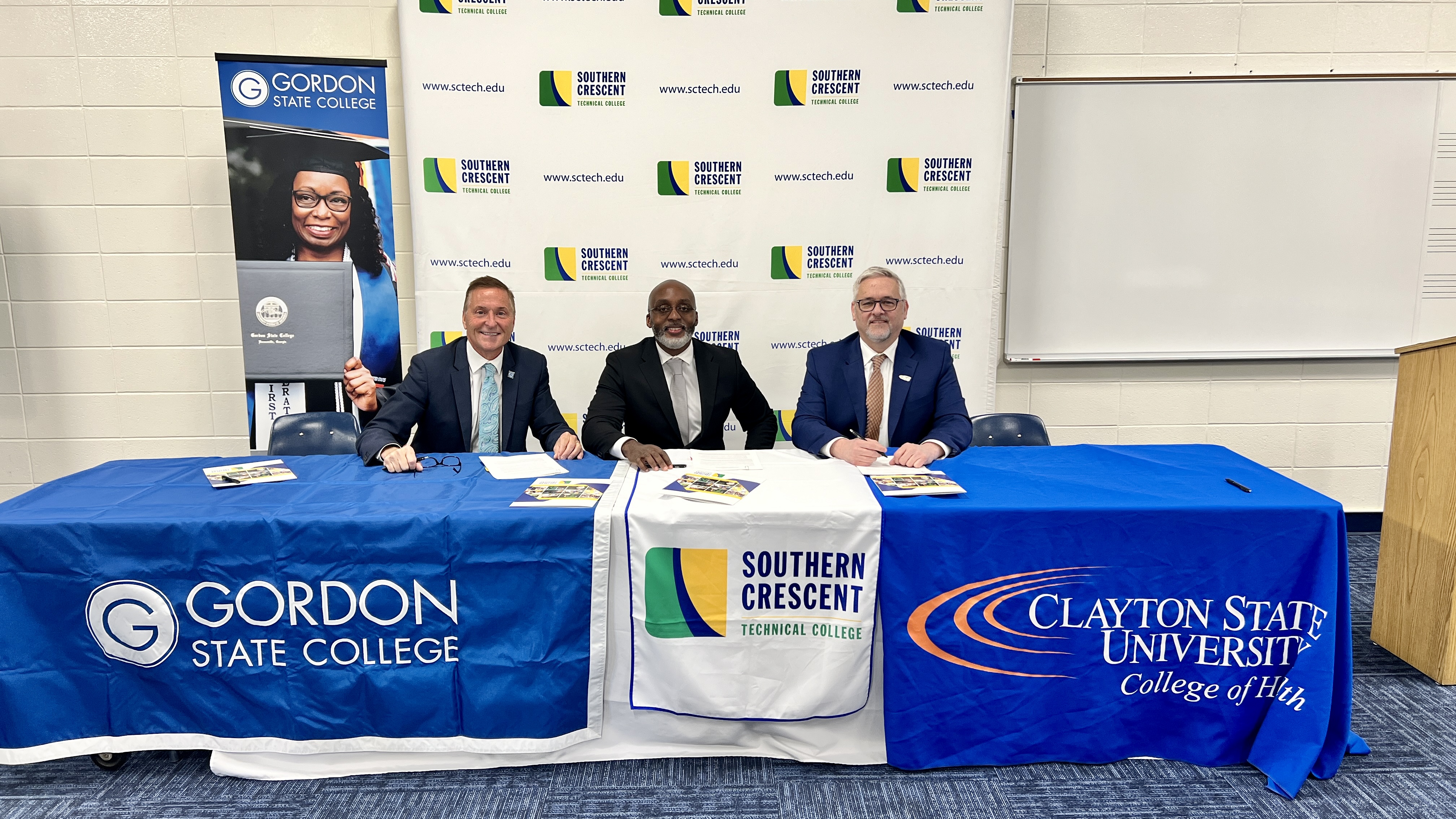 Gordon State College President Dr. Donald Green, SCTC President Dr. Irvin Clark and Clayton State University Dean of the College of Health Dewayne Hooks, sign articulation agreements at the RN Bridge Launch Program
